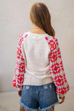 White sweater with pink & orange crochet sleeves (back)