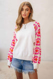 White sweater with pink & orange crochet sleeves