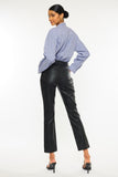 Back of black high waist straight leg faux leather pants