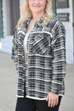 Black plaid flannel shacket with fringe edge