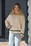 Cream sweater with green trim
