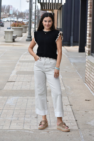White cuffed jeans with olive green stripes