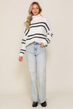 White/black striped turtleneck sweater